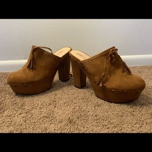 Brown studded clogs